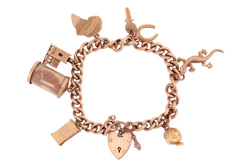Lot A 9ct gold charm bracelet, the curb link chain...