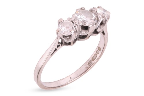 Lot A diamond three-stone ring in 18ct white gold,...