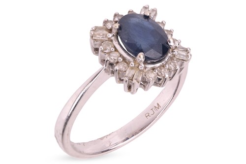 Lot A sapphire and diamond cluster ring,...