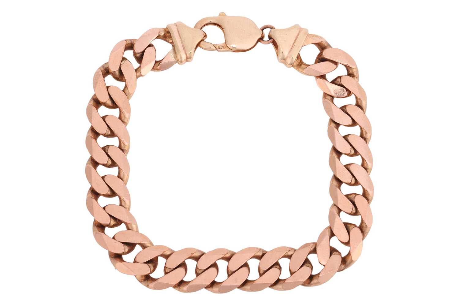 Lot 243 - A flat curb link bracelet in 9ct gold,...