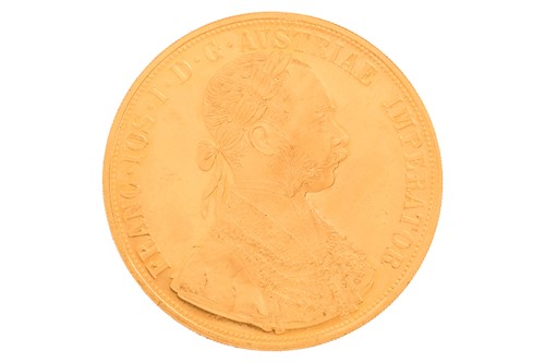 Lot 135 - An Austrian 1915 four ducat gold coin, 14...