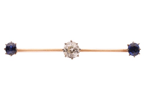 Lot A diamond and sapphire bar brooch, centred...