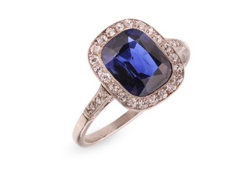 Lot An Art Deco sapphire and diamond halo ring,...
