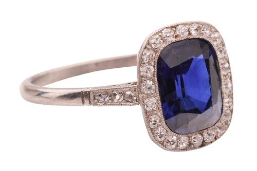 Lot An Art Deco sapphire and diamond halo ring,...