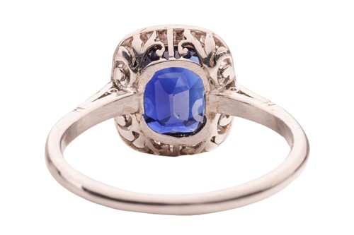 Lot An Art Deco sapphire and diamond halo ring,...