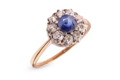 Lot A sapphire and diamond cluster ring, centred...