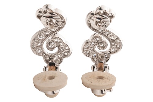 Lot 267 - Cartier - a pair of diamond-set scrolling...