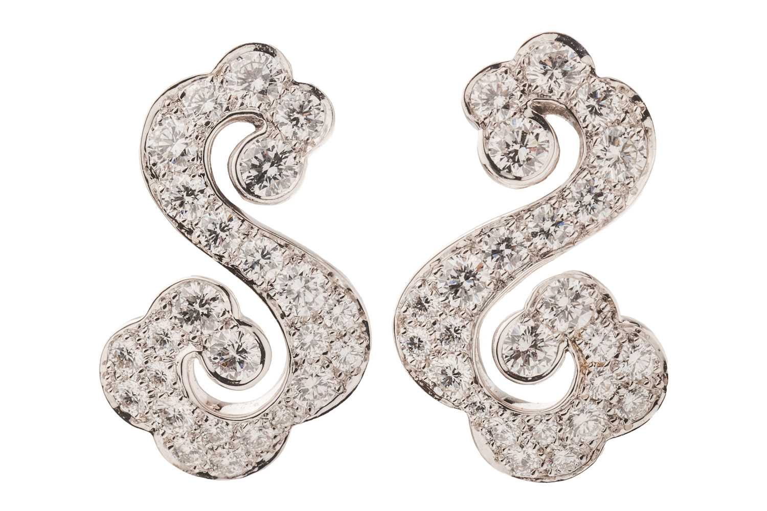 Lot 267 - Cartier - a pair of diamond-set scrolling...