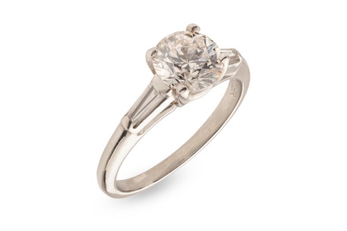 Lot Cartier - a diamond solitaire ring, centred...