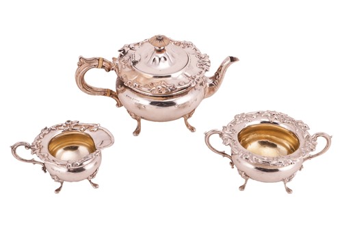 Lot 424 - A three-piece silver tea service of squat...