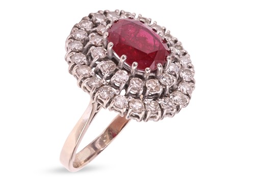 Lot 296 - A ruby and diamond cluster ring, centred with...