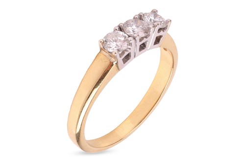 Lot 43 - A diamond trilogy ring in 18ct gold, claw-set...