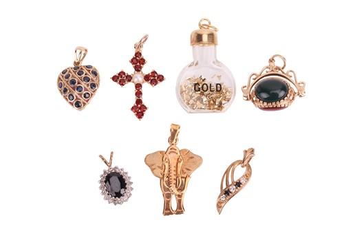 Lot A group of pendants, to include a hardstone...