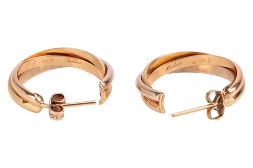 Lot 160 - Cartier - a pair of trinity hoop earrings,...