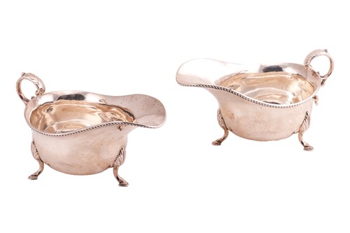 Lot 407 - A pair of George II-style silver gravy boats...