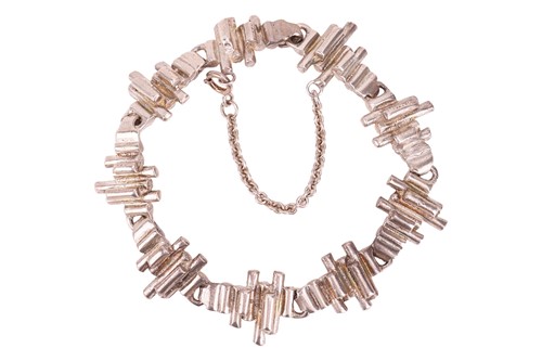 Lot 215 - A Modernist link bracelet, of undulating reed...