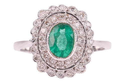 Lot 273 - An emerald and diamond panel ring, centred...