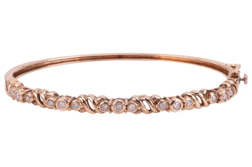 Lot 194 - A diamond-set hinged bangle, composed of five...