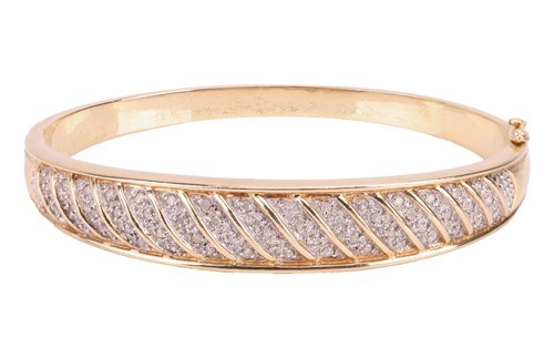 Lot 88 - A diamond-set hinged bangle, in 9ct gold, set...