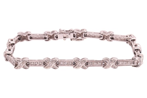 Lot 154 - A diamond-set line bracelet in 9ct white gold,...