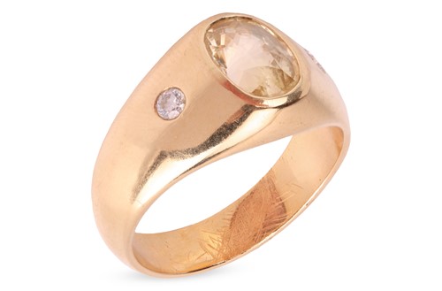 Lot 182 - A yellow sapphire gypsy ring, centred with an...
