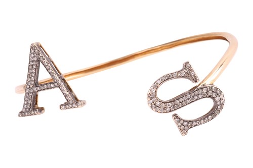 Lot 230 - A diamond-set initials torque bangle, the open...