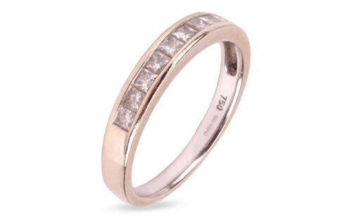 Lot 239 - A diamond half-eternity ring in 18ct white...
