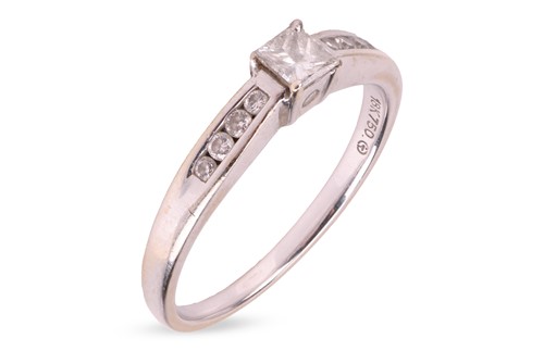 Lot 108 - A diamond solitaire ring, comprising a central...