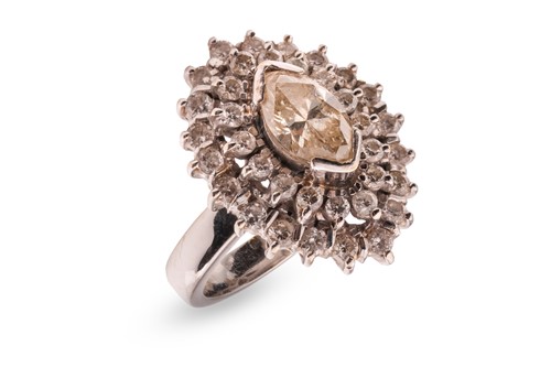 Lot 180 - A diamond cluster ring, comprising a central...