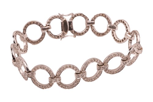Lot 163 - A diamond-set circular link bracelet, each...