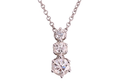 Lot 140 - A three-stone diamond pendant on chain, the...