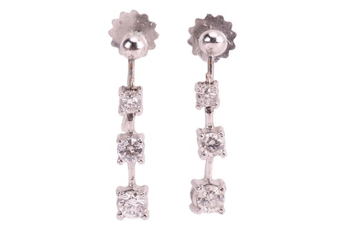 Lot 60 - A pair of diamond-set drop earrings, graduated...