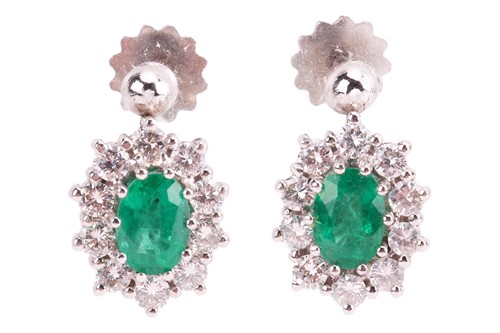 Lot 25 - A pair of emerald and diamond cluster earrings,...