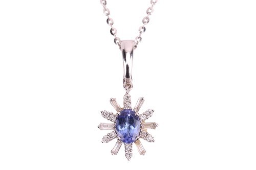 Lot 238 - A tanzanite and diamond floral cluster pendant...