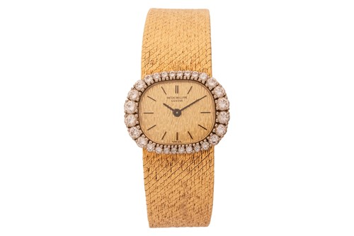 Lot 366 - Patek Philippe An 18ct Gold Diamond-set Dress...