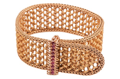 Lot A ruby-set woven jarretière bracelet, retailed...