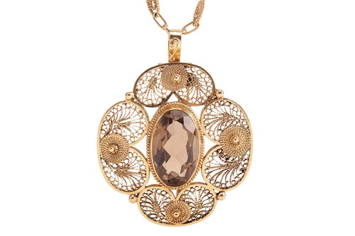 Lot 225 - A large smoky quartz brooch cum pendant on...