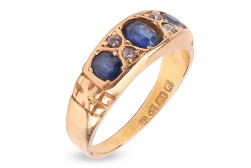 Lot 210 - An Edwardian sapphire and diamond half-hoop...