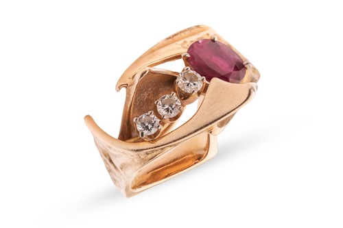 Lot 98 - A Modernist ruby and diamond dress ring,...