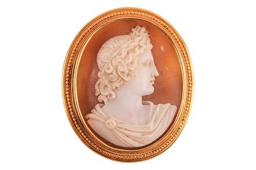 Lot 21 - A 19th-century shell cameo brooch, depicting...