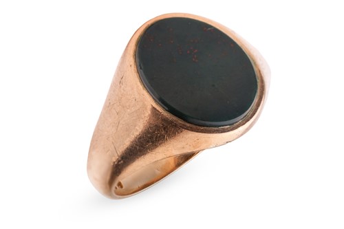 Lot 149 - A bloodstone signet ring in 9ct gold, set with...