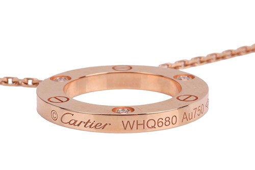 Lot 289 - Cartier - a 'Love' pendant on chain, set with...