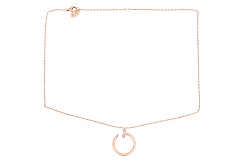 Lot 279 - Cartier - a 'Juste un Clou' pendant on chain,...