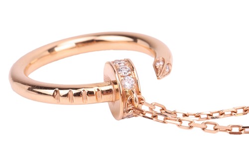 Lot 279 - Cartier - a 'Juste un Clou' pendant on chain,...