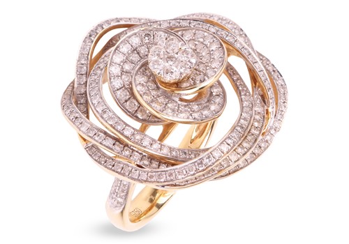 Lot 135 - A diamond-set twizzle ring in the form of a...