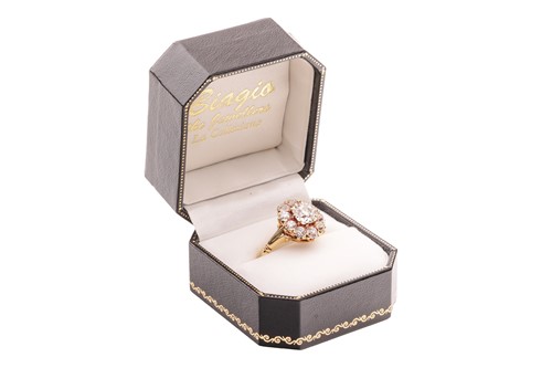 Lot 261 - An old-cut diamond cluster ring, with an...