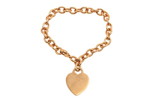 Lot 266 - Tiffany & Co. - a link bracelet with heart...