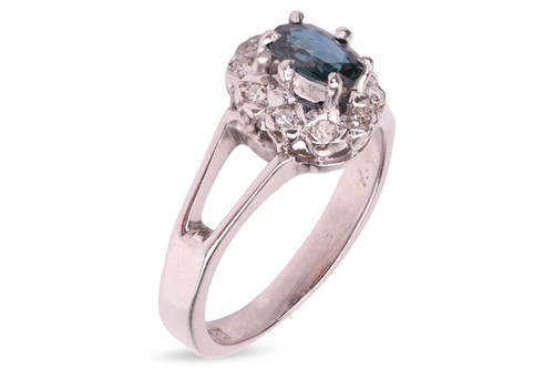 Lot A sapphire and diamond cluster ring in 18ct...