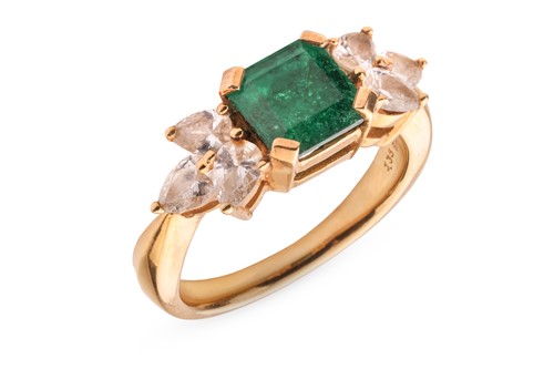 Lot An emerald and diamond dress ring, claw-set to...