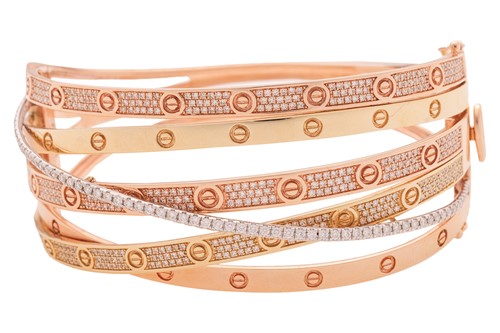 Lot 96 - A diamond-set three-tone hinged bangle, of...